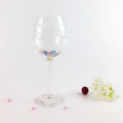 circle carving red wine glass